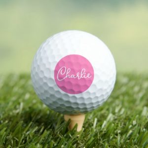 Custom name or text on pink background golf balls