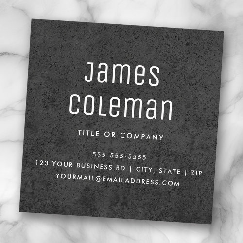 Black square business card design with dark concrete texture background and customizable white text and logo.