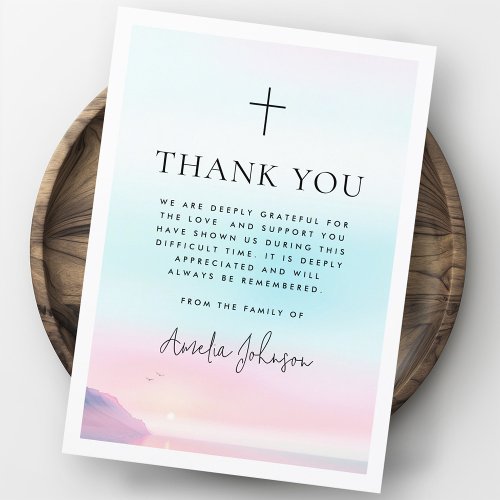 Christian sympathy thank you card with cross and pastel sunrise/sunset background, customizable with name and memorial text.