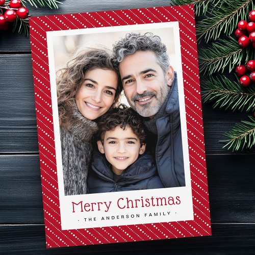 Customizable Christmas card with red diagonal dotted stripe border, large central photo area, Merry Christmas greeting, and personalized family name.