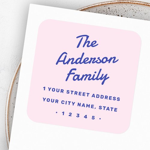 Custom family return address sticker featuring a retro script font, bold blue block lettering, and soft pastel pink background.