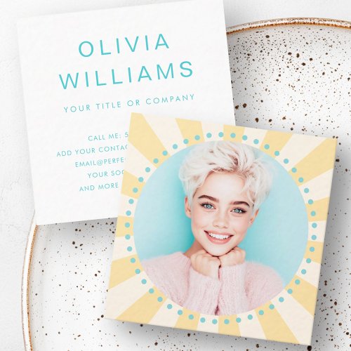 Square business card with personalized photo, yellow sunburst design, turquoise accents, and customizable contact details.