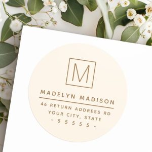 Modern, minimalist monogram cream colored return address label