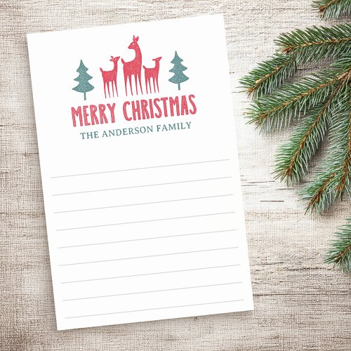 Christmas sticky notes notepad with red reindeer family and green fir trees at top, bold “Merry Christmas” in red, custom family name in green, and lined white pages. Personalized holiday stationery for lists, notes, and seasonal organization.