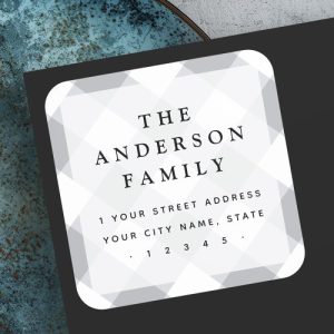 Personalized gray plaid return address label with gingham background and custom family name.